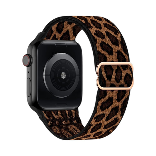 Correa elástica The Strap Society México para Apple Watch con estampado de leopardo y hebilla metálica en tono oro
